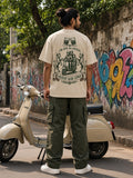 Adjust Kar Lenge oversized tee in beige, back print shown on model - Matchbox Society Drop 01