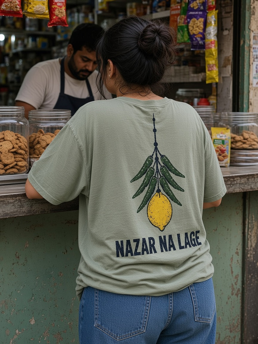 Nazar Na Lage oversized tee in sage, back print shown on model - Matchbox Society Drop 01