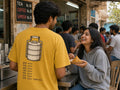 Tiffin Mein Phir Aloo oversized tee in mustard, back print shown on model - Matchbox Society Drop 01